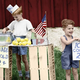 Colorized 1940s photo of little boys at lemonade stand